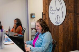 staff greet clients in a perinatal mood disorder treatment program