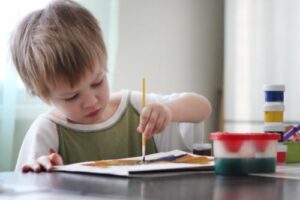 child drawing in an autism spectrum disorder treatment program