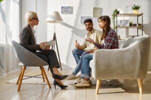 clients in a mental health treatment center discuss treatment