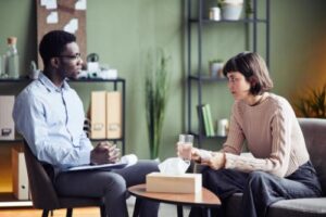 therapist talks with client about mental health counseling and therapy