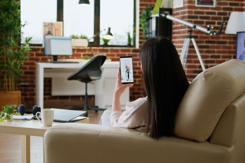 woman talks with her doctor through telehealth appointments