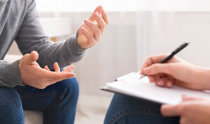 client and therapist discussing a learning disabilities treatment program