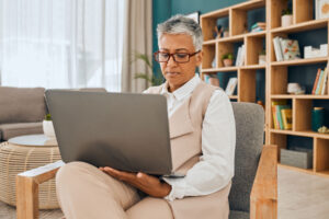 person talking to therapist on laptop considers the benefits of telehealth for mental health