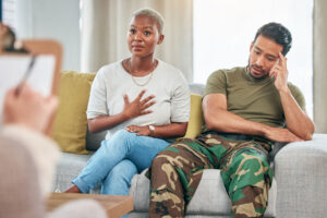 therapist talks with veteran and loved one during treatment for ptsd in bowie