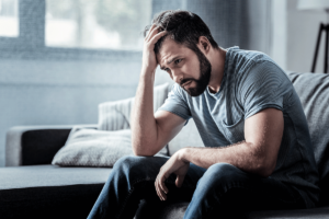 man leans forward and considers what is treatment-resistant depression