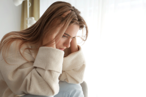 a woman struggles to cope with symptoms of manic depression or bipolar disorder