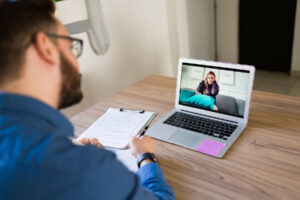 man talking to therapist online about online therapy for anxiety