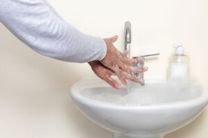 person washing hands wonders about ocd behaviors