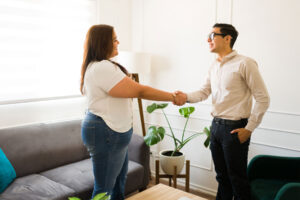 A man is meeting his therapist for the first time. He is there to discuss his people-pleasing as a trauma response.