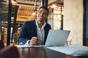 A man with ADHD is in a business meeting and thriving, after learning tips to overcome ADHD paralysis.