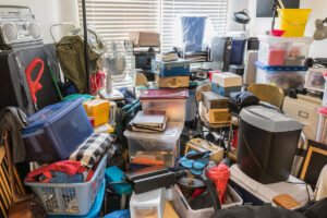 A room is so packed with items that there is no longer floor space remaining.