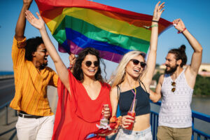 Group of friends, people attend a gay pride event